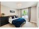 A bright bedroom with a large window and neutral decor creating a calming atmosphere at 1590 Johnson Ne Rd, Atlanta, GA 30306