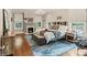 Serene bedroom featuring a large bed, fireplace, wood floors, and an area rug at 1590 Johnson Ne Rd, Atlanta, GA 30306