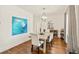 Elegant dining room featuring hardwood floors, a modern light fixture, and stylish decor at 1590 Johnson Ne Rd, Atlanta, GA 30306