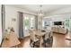 Beautiful dining area offering hardwood floors, a stylish chandelier, and easy access to the living area at 1590 Johnson Ne Rd, Atlanta, GA 30306