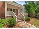 Beautiful home with brick and stone facade, a covered porch, and manicured landscaping, exuding curb appeal at 1590 Johnson Ne Rd, Atlanta, GA 30306