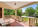 Inviting front porch with brick flooring and a cozy seating area, perfect for relaxing outdoors at 1590 Johnson Ne Rd, Atlanta, GA 30306