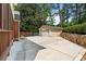 Spacious driveway and detached garage, complemented by a neatly maintained lawn and attractive stone retaining wall at 1590 Johnson Ne Rd, Atlanta, GA 30306