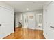 Hallway featuring hardwood floors with access to other rooms and bathrooms in the house at 1590 Johnson Ne Rd, Atlanta, GA 30306