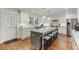 Bright kitchen with stainless steel appliances, large island with seating, and a door to the outside at 1590 Johnson Ne Rd, Atlanta, GA 30306