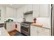 White kitchen featuring stainless steel appliances, countertops, and white cabinets at 1590 Johnson Ne Rd, Atlanta, GA 30306