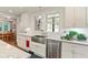 Bright kitchen with stainless steel appliances, countertops, and white cabinets at 1590 Johnson Ne Rd, Atlanta, GA 30306