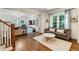 Inviting living room with hardwood floors, neutral-toned sofas, and abundant natural light at 1590 Johnson Ne Rd, Atlanta, GA 30306