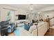 Bright and airy living room with hardwood floors, large windows, and stylish furnishings, ideal for relaxation at 1590 Johnson Ne Rd, Atlanta, GA 30306