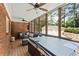 Screened patio with hot tub and outdoor seating area, perfect for enjoying the lush backyard at 1590 Johnson Ne Rd, Atlanta, GA 30306