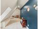 Fun, bright playroom has a geometric ceiling, storage for toys, and seating at 1590 Johnson Ne Rd, Atlanta, GA 30306