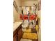 Bathroom with vibrant shower curtain, wooden cabinets, and tiled floor, adding a splash of personality at 2118 Burns View Ln, Lawrenceville, GA 30044