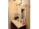 Bathroom with a vanity, framed mirror, and modern lighting, offering a clean and functional space at 2118 Burns View Ln, Lawrenceville, GA 30044