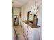 Bedroom view of white dresser with a rustic wood top and decorative items displayed on top at 2118 Burns View Ln, Lawrenceville, GA 30044