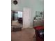 A bedroom view of decorative mirror and bench, dresser, pillows, and wall accents at 2118 Burns View Ln, Lawrenceville, GA 30044