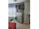 Modern bedroom showing a tall, mirrored dresser with a TV and a plush chaise lounge at 2118 Burns View Ln, Lawrenceville, GA 30044