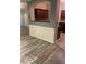 Dining area with wood floors, gray accent wall, and wall paneling at 2118 Burns View Ln, Lawrenceville, GA 30044