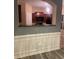 Open dining room with wainscoting trim, modern flooring, and kitchen view at 2118 Burns View Ln, Lawrenceville, GA 30044