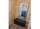 Cozy foyer with a tufted ottoman, decorative mirror, and modern accessories at 2118 Burns View Ln, Lawrenceville, GA 30044