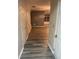 Spacious hallway featuring stylish, durable flooring that leads to the living areas at 2118 Burns View Ln, Lawrenceville, GA 30044