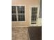 Kitchen area featuring a window with blinds, a door, and gray countertops at 2118 Burns View Ln, Lawrenceville, GA 30044