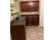Kitchen sink and dark wood cabinetry with gray countertops at 2118 Burns View Ln, Lawrenceville, GA 30044