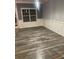 Bright living room featuring wainscoting trim, stylish flooring, and natural light at 2118 Burns View Ln, Lawrenceville, GA 30044