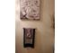 Elegant powder room featuring rose artwork, decorative towels, and stylish decor at 2118 Burns View Ln, Lawrenceville, GA 30044