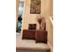 Stylish stairway landing with decorative ottomans, showcasing the home's unique design at 2118 Burns View Ln, Lawrenceville, GA 30044