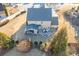 Aerial view of the home, highlighting the outdoor seating, patio, and well-manicured landscaping at 2225 Independence Ln, Buford, GA 30519