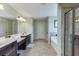 Bathroom featuring double vanity, soaking tub, stand up shower and tile floors at 2225 Independence Ln, Buford, GA 30519