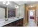 Bathroom featuring a double vanity, tiled floor, and Falcons shower curtain at 2225 Independence Ln, Buford, GA 30519