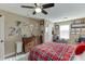 Bedroom with ceiling fan, carpeted floors, natural lighting and plaid bedding at 2225 Independence Ln, Buford, GA 30519