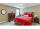 Cozy bedroom with red bedding, carpet, and dresser; a comfortable guest space at 2225 Independence Ln, Buford, GA 30519