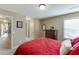 Bedroom with carpet, dresser, and closet, complemented by natural light from window at 2225 Independence Ln, Buford, GA 30519