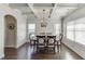 Formal dining room featuring wainscoting, coffered ceilings, and a stylish chandelier at 2225 Independence Ln, Buford, GA 30519