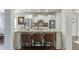 Well-lit kitchen boasting stainless steel appliances, double ovens, and granite countertops with bar seating at 2225 Independence Ln, Buford, GA 30519