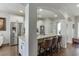 Kitchen with stainless steel appliances, white cabinets, granite countertops and breakfast bar seating at 2225 Independence Ln, Buford, GA 30519