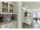 Open-concept kitchen with granite countertops, stainless steel appliances, and ample cabinet space at 2225 Independence Ln, Buford, GA 30519