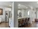 Open kitchen features stainless steel appliances, granite countertops, and a breakfast bar with seating at 2225 Independence Ln, Buford, GA 30519