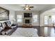 Open living room features a stone fireplace, hardwood floors, and access to the back patio at 2225 Independence Ln, Buford, GA 30519