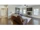 Spacious living room features a stone fireplace, hardwood floors, and a comfortable leather sofa at 2225 Independence Ln, Buford, GA 30519