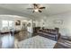 Spacious living room with hardwood floors, modern lighting and neutral paint at 2225 Independence Ln, Buford, GA 30519