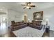 Inviting living room featuring hardwood floors, neutral walls, and plush brown leather seating at 2225 Independence Ln, Buford, GA 30519