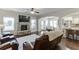 Bright and airy living room with a fireplace, access to the kitchen, and hardwood floors at 2225 Independence Ln, Buford, GA 30519