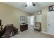 Carpeted office with chair, desk, storage drawers and overhead lighting at 2225 Independence Ln, Buford, GA 30519