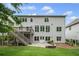 Backyard with a deck, stairs, patio, and a fire pit at 2740 Cezanne Ln, Cumming, GA 30041