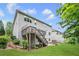 Backyard with a deck, stairs, landscaped garden, and lawn at 2740 Cezanne Ln, Cumming, GA 30041