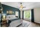 Bedroom with hardwood floors, and a large window at 2740 Cezanne Ln, Cumming, GA 30041
