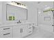 Modern bathroom with double sink vanity, large mirror, and shower tub with marble tile surround at 400 Auburn Rd, Auburn, GA 30011